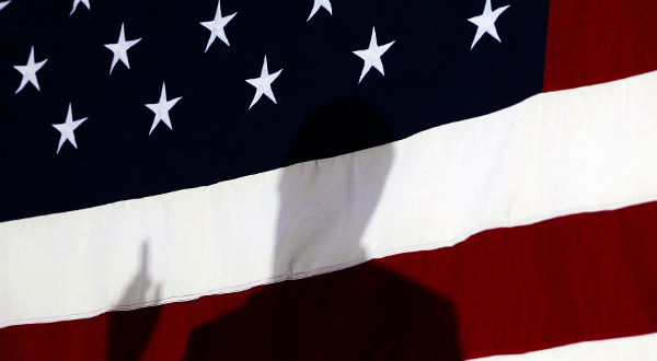 Reuters-Newt-Gingrich-silhouette-American-flag-photog-Shannon-Stapleton