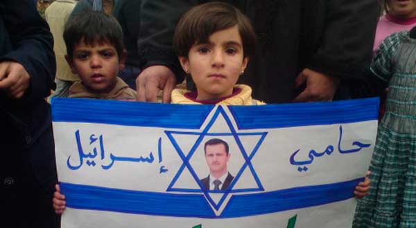 Reuters-Syria-child-poster-demonstration-Syrian-president-photog-Handout